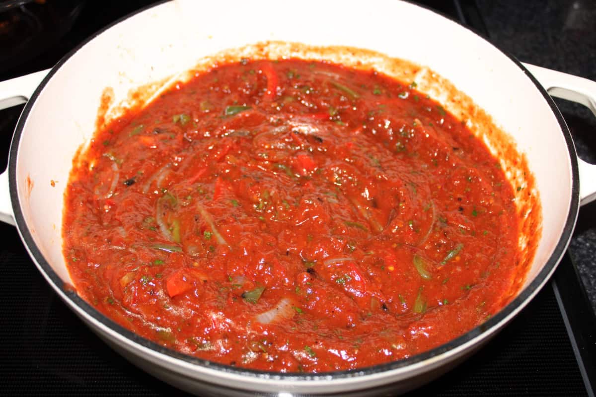 Simmering Tinga Sauce with Cooked Onions and Peppers