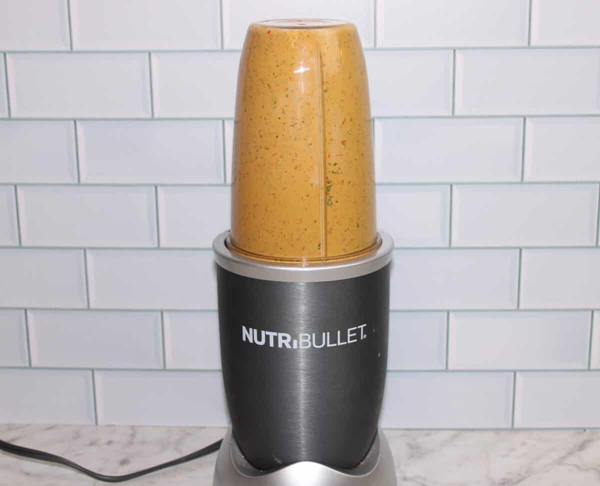 Close-up of a chipotle mayo ingredients in a blender cup.